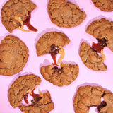 Sticky Toffee Pudding New York Cookie with gooey sticky toffee filling oozing from warm baked cinnamon ginger cookies.